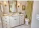 Charming bathroom with a patterned shower curtain, marble countertop, and a classic design at 1541 Bay Point Dr, Sarasota, FL 34236