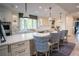 Bright kitchen featuring an island with seating, stainless appliances, and granite counters at 1541 Bay Point Dr, Sarasota, FL 34236