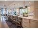 Bright, spacious kitchen with marble counters, an island with seating, and pendant lighting at 1541 Bay Point Dr, Sarasota, FL 34236