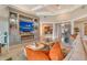 Comfortable living room with a fireplace, built-in shelving, and stylish decor at 1541 Bay Point Dr, Sarasota, FL 34236