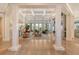 Bright and airy living room with coffered ceilings, large windows, and comfortable seating at 1541 Bay Point Dr, Sarasota, FL 34236