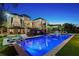 An impressive backyard pool area features a large pool, spa, and elegant outdoor lounge spaces at 1541 Bay Point Dr, Sarasota, FL 34236