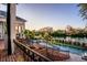 Outdoor pool, waterway view, and well-manicured garden at 1541 Bay Point Dr, Sarasota, FL 34236