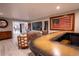 Chic recreation room with a custom bar area, a large wine cellar, and comfortable seating arrangements at 1541 Bay Point Dr, Sarasota, FL 34236
