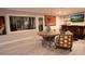 Inviting recreation room featuring a stylish bar, a temperature-controlled wine cellar, and ample seating at 1541 Bay Point Dr, Sarasota, FL 34236