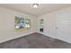 Neutral bedroom with a large window and ample natural light at 2155 Jagust Rd, North Port, FL 34288