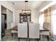 Bright dining room features modern light fixture and neutral decor at 2155 Jagust Rd, North Port, FL 34288