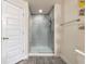Modern bathroom with glass enclosed tiled shower and neutral walls at 2155 Jagust Rd, North Port, FL 34288