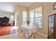 Cozy breakfast nook with a bright window overlooking the pool area, perfect for casual dining at 2737 Harvest Dr, Sarasota, FL 34240