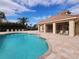 Inviting community pool surrounded by lush greenery and a clubhouse for resort-style living at 2737 Harvest Dr, Sarasota, FL 34240