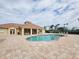 Resort-style community pool with ample seating and a beautiful clubhouse, perfect for relaxation and socializing at 2737 Harvest Dr, Sarasota, FL 34240