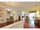 Bright living room with hardwood floors, comfortable seating, elegant decor, and arched doorways at 2737 Harvest Dr, Sarasota, FL 34240