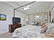Light-filled main bedroom with pool view, a four-poster bed, and classic furnishings at 2737 Harvest Dr, Sarasota, FL 34240