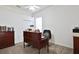 Office features a wood desk, ample storage, and natural light, perfect for a workspace at 2737 Harvest Dr, Sarasota, FL 34240