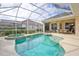 Enclosed pool and spa area features ample seating and a well-maintained backyard at 2737 Harvest Dr, Sarasota, FL 34240