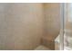 Bright bathroom showcasing neutral tiles with convenient bench seating, designed for relaxation and ease at 3439 101St E Ave, Parrish, FL 34219