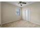 Bright, minimalist bedroom with neutral carpet and large closet, offering a versatile living space at 3439 101St E Ave, Parrish, FL 34219