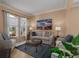Inviting living room with comfortable seating, stylish decor, and plenty of natural light at 3439 101St E Ave, Parrish, FL 34219