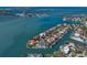 Stunning aerial view of a waterfront community with luxurious homes, private docks, and ocean access at 367 W Royal Flamingo Dr, Sarasota, FL 34236