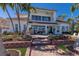 Beautiful two-story home featuring a patio, pool, and well-maintained green spaces at 367 W Royal Flamingo Dr, Sarasota, FL 34236