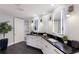 Stylish bathroom featuring dual sinks, backlit mirrors, and modern fixtures at 367 W Royal Flamingo Dr, Sarasota, FL 34236