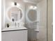 Modern bathroom with a glass shower, stylish vanity, illuminated mirror, and neutral tile, creating a spa-like atmosphere at 367 W Royal Flamingo Dr, Sarasota, FL 34236