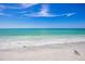Serene beach scene featuring turquoise water, white sand, and clear blue skies, offering a tranquil coastal view at 367 W Royal Flamingo Dr, Sarasota, FL 34236