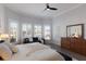 Bright bedroom featuring a sitting area with large windows and shutter blinds at 367 W Royal Flamingo Dr, Sarasota, FL 34236