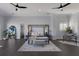 Elegant bedroom featuring dark hardwood floors, a four-poster bed, and stylish decor at 367 W Royal Flamingo Dr, Sarasota, FL 34236