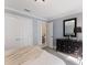Cozy bedroom featuring a dresser, mirror, and entry to the bathroom, complemented by stylish decor and fresh colors at 367 W Royal Flamingo Dr, Sarasota, FL 34236