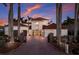 Beautiful two-story home with a red-tile roof, meticulously maintained landscaping, and brick-paved driveway at 367 W Royal Flamingo Dr, Sarasota, FL 34236