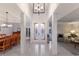 Elegant foyer with decorative glass doors, open floor plan and grand chandelier at 367 W Royal Flamingo Dr, Sarasota, FL 34236