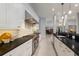 Contemporary kitchen with stainless steel appliances and open design flowing into other living areas at 367 W Royal Flamingo Dr, Sarasota, FL 34236