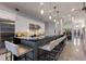 Spacious kitchen with large breakfast bar, modern appliances, and elegant lighting fixtures at 367 W Royal Flamingo Dr, Sarasota, FL 34236