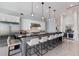 Bright, open kitchen with a large island, stainless steel appliances, and sleek pendant lighting at 367 W Royal Flamingo Dr, Sarasota, FL 34236