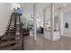 Open concept living area with staircase, marble floors, columns, and view of the backyard at 367 W Royal Flamingo Dr, Sarasota, FL 34236