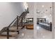 Spacious living room featuring modern stairs, open-concept design and natural light at 367 W Royal Flamingo Dr, Sarasota, FL 34236