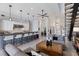 Open floor plan with a modern kitchen flowing into the stylish living area and staircase at 367 W Royal Flamingo Dr, Sarasota, FL 34236