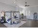 Elegant main bedroom with a canopy bed, contemporary decor, and dark hardwood flooring at 367 W Royal Flamingo Dr, Sarasota, FL 34236