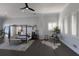 Bright main bedroom with dark wood floors, plantation shutters, and a decorative writing desk at 367 W Royal Flamingo Dr, Sarasota, FL 34236