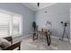 Stylish home office featuring natural light, modern furniture, and a calm atmosphere at 367 W Royal Flamingo Dr, Sarasota, FL 34236