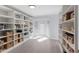 Spacious walk-in pantry with custom shelving, white cabinets, and a bright window at 367 W Royal Flamingo Dr, Sarasota, FL 34236