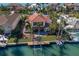 Luxury waterfront home boasting a private pool, lush landscaping, and a private boat dock at 367 W Royal Flamingo Dr, Sarasota, FL 34236