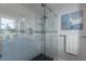 Glass enclosed shower with sleek fixtures and mosaic tile accent at 367 W Royal Flamingo Dr, Sarasota, FL 34236