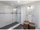 Modern bathroom shower with gray tile, and bright natural light at 367 W Royal Flamingo Dr, Sarasota, FL 34236