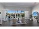 Bright sitting area with water view, showcasing elegant seating and seamless indoor-outdoor flow through large windows at 367 W Royal Flamingo Dr, Sarasota, FL 34236