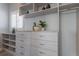 Organized walk-in closet with ample shelving, drawers, and a bright window at 367 W Royal Flamingo Dr, Sarasota, FL 34236