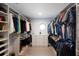 Organized walk-in closet with custom shelving and storage for clothes and accessories at 367 W Royal Flamingo Dr, Sarasota, FL 34236