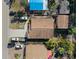 Property overview showing house, driveway, and surrounding area at 4704 Town N Country Blvd, Tampa, FL 33615