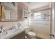 Clean bathroom with a shower/tub combo and vanity at 4704 Town N Country Blvd, Tampa, FL 33615